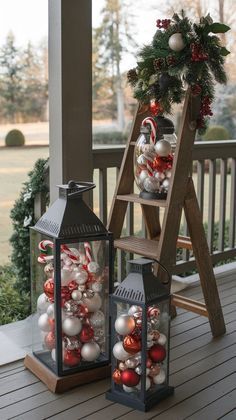 two lanterns on the porch decorated for christmas