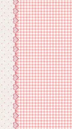 a pink and white checkered table cloth with lace on the edge, as well as polka dots