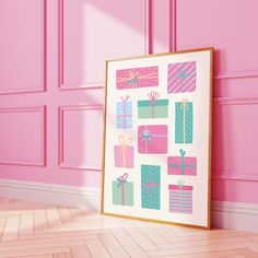 a pink room with a large framed present box art print on the wall and wooden floor