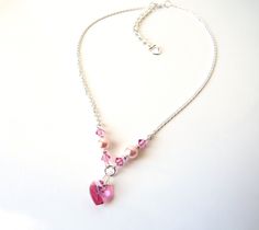 A beautiful necklace that's perfect for weddings, holidays or any special occasion!  ♥ All jewelry comes in a gift box and is ready to give! ♥ This necklace is handmade using:  ~Delicate Sterling Silver 1.7mm diamond cut curb chain (CHOICE OF LENGTH) ~Pink rose vegan pearl beads (6mm) ~Pink rose heart shaped crystal (10mm)  ~Pink rose crystals (4mm) ~INCLUDES 2 INCH GROW CHAIN EXTENSION for adjustable sizing, embellished with silver heart charm ---------- There are many more unique items, including women's jewelry ~ Back to main shop: http://etsy.me/29ztspj ------RETURN POLICY-------  ~ Items must be returned in an unused condition and in its original packaging within 30 days of receipt of the order. ~ The customer must contact MelJoy Creations prior to returning the item. ~ Refunds are gi Pink Heart Necklace, Crystals Swarovski, Heart Charm Necklace, Natural Gemstone Necklace, Gemstone Choker, Rose Heart, Turquoise Bead Necklaces, Wedding Jewellery Necklace, Beautiful Necklace