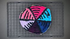 a colorful plate sitting on top of a metal rack