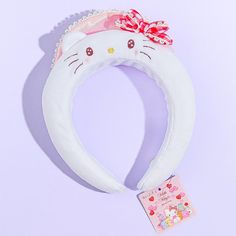 Add a major dose of cuteness to your outfit of the day with this kawaii Hello Kitty headband. It was made in celebration of Hello Kitty's 50th anniversary! This headband showcases Hello Kitty with dreamy eyes and blushing cheeks. Wear it when you head to cafes with your friends. Cute White Birthday Headband, Cute White Headband For Birthday, Cute Adjustable White Headband, Cute White Hair Accessories With Matching Headband, Adjustable White Cat Ears Headband, White Adjustable Kawaii Hair Accessories, Fun White Headband As Gift, Fun White Headband For Gift, Fun White Headband As A Gift