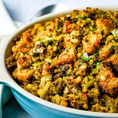 a casserole dish filled with stuffing and vegetables