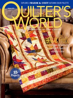 the cover of quilter's world magazine with a couch and chair in front