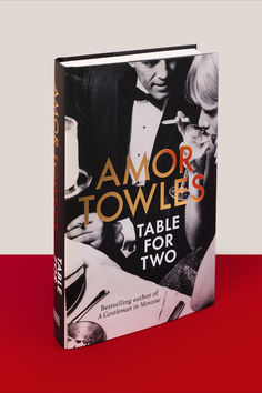 a book with an image of two people in tuxedos and the title armor towels table for two