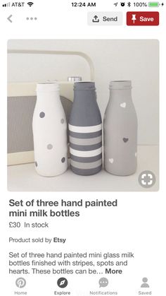 three hand painted mini milk bottles in grey and white with polka dots on the bottom