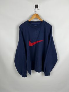 Vintage Nike Big Swoosh 90's Navy Blue Sweatshirt Size XL Tagged Size: L Measurements: 1.Length- 70CM (27.5") 2.Chest- 60CM (23.6") 3.Shoulders- 60CM (23.6") 4.Sleeves- 60CM (23.6") Condition: Gently used without any noticeable imperfections; (small stain displayed under the neck seam) Material: 100% Cotton A76 Oversized Blue 90s Sweatshirt, Navy Blue Sweatshirt, Nike Retro, Nike Vintage, Blue Sweatshirt, Vintage Nike, Adventure Time, Sweat Shirt, Gender Neutral