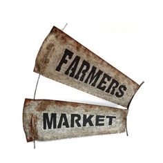 two rusty metal signs that say farmers market