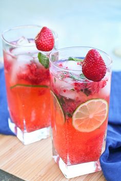 two glasses filled with ice and strawberries