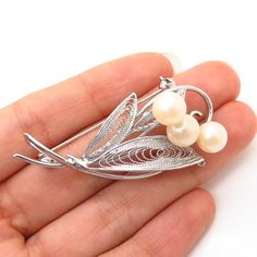 925 Sterling Silver Vintage Faux Pearl Filigree Floral Design Pin BroochWeight: 8.0gWELCOME TO PAWN SHOPWe are an actual pawn shop and have been in business for over 25 years.Since 1990, our establishment has been serving a variety of clients by providing them with short term cash solutions and options of liquidity regarding their treasured heirlooms.Acknowledging that today′s customers are very sophisticated and are looking for a variety of investments, our acquisitions are hand-picked for our Classic Silver Filigree Brooches, Classic Filigree Brooches As Gifts, Pawn Shop, Pin Brooch, Hand Picked, 25 Years, Faux Pearl, Brooch Pin, Ear Cuff