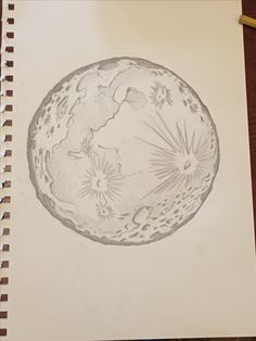 a drawing of the moon is shown on paper