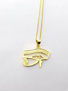 Eye of Horus Gold Necklace, 14k Gold Vermeil Over Sterling Silver Eye Necklace, Egyptian Jewelry.Eye of Horus, in ancient Egypt, a symbol representing protection, health, and restoration.According to Egyptian myth, Horus lost his left eye in a struggle with Seth. The eye was magically restored by Hathor, and this restoration came to symbolize the process of making whole and healing. For this reason, the symbol was often used in amulets.• Material: Eye Of Horus necklace is handcrafted using premi Gold Ancient Style Engraved Necklace, Ancient Style Gold Engraved Necklace, Ancient Style Engraved Gold Necklace, Symbolic 14k Stamped Pendant Jewelry, Ancient Gold Pendant Jewelry, Ancient Style Gold Pendant Jewelry, Symbolic 14k Gold Necklaces, Gold Pendant Jewelry In Vintage Style, Symbolic 14k Gold Necklace