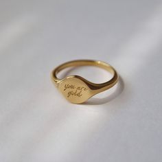 Embrace the beauty of simplicity with our "you are gold" signet ring, symbolizing self-love and empowerment. A timeless piece for your collection, this ring will serve as a reminder of your confidence, worth and strength.  -stainless steel, gold plated Beauty Of Simplicity, Gold Signet Ring, Jewelry Case, Signet Ring, Pearl Jewelry, Shop Necklaces, Timeless Pieces, Ring Earrings, The Beauty