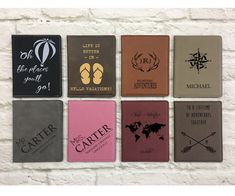 six different colored passport cases hanging on a brick wall with the words, life is better when you go