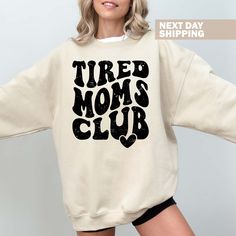 Hi! Welcome to the TeeScape! It's great to see you here! Tired Moms Club Sweatshirt, Mothers Day Sweater, Funny Mama Hoodie, Gift for Mama, Mama Club Sweater, Mama Life Hoodie, Mom Clothing Our shirts are clean, high quality and soft. It is prepared quickly by our store! Enjoy your shopping! It is a pleasure for us to help you with your questions and you can reach us at any time. F I T ∙ S I Z I N G -->Women's sizes are narrower than the waist -->Sleeves are rolled up in some product pictures. T Comfy Hoodie Sweatshirt With Letter Print, Comfy Letter Print Hoodie Sweatshirt, Comfy Hooded Sweatshirt With Letter Print, Comfortable Crew Neck Hoodie With Letter Print, Comfortable Fleece Sweats With Letter Print, Cozy Sweats With Letter Print For Leisure, Cozy Letter Print Sweats For Leisure, Mom Clothing, Mama Hoodie