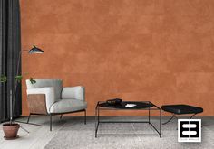 a living room with two chairs and a coffee table in front of an orange wall