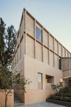 an image of a building that is made out of bricks and concrete with stairs leading up to it