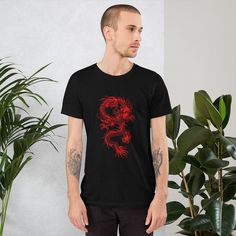 "Japanese Dragon Shirt | Red Dragon T-Shirt | Traditional Japan Dragon Art Drawing Tee |  Aesthetic Grunge Clothing | Unisex T-Shirt A Japanese dragon, also known as ryū (ryu) or tatsu (龍 or 竜, \"dragon\") is a mythical animal from Japan. Like other creatures called dragons, the Ryū is a big, fantastic animal that looks similar to a serpent, and is related to the Chinese lóng and the Korean yong. You've now found the staple t-shirt of your wardrobe. It's made of a thicker, heavier cotton, but it's still soft and comfy. And the double stitching on the neckline and sleeves add more durability to what is sure to be a favorite!   * 100% ring-spun cotton * Sport Grey is 90% ring-spun cotton, 10% polyester * Dark Heather is 65% polyester, 35% cotton * 4.5 oz/y² (153 g/m²) * Pre-shrunk * Shoulder Japan Dragon Art, Dragon Art Drawing, Japan Dragon, Angel Shirt, Feminist Clothes, Feminism Shirt, Dragon Shirt, Grunge Clothing, Girlfriend Shirts