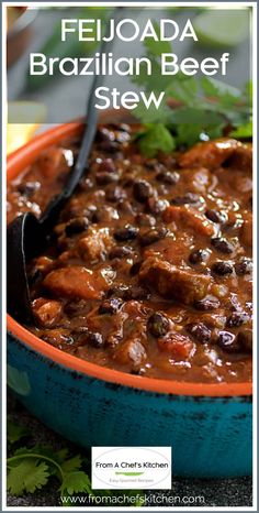 a close up of a bowl of food with the words fejoada brazilian beef stew