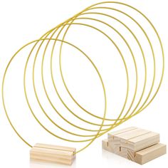 PRICES MAY VARY. Package Includes: You will receive 5 pieces of golden metal rings with 5 pieces wood place card holder in the package, enough for you to decorate your wedding, engagement, party. Size: The gold round metal hoops is about 10 inches in diameter and the wood place card holders is 2.75 x 1.38 x 0.7 inch / 7 x 3.5 x 1.8 cm. High Quanlity: The metal hoop is made of sturdy metal, each thickness is 3mm. They do not deform or break easily. This wooden stand is made from natural wood, and Gold Ring Arch Wedding, Metal Hoop Christmas Wreath, Simple Round Table Wedding Decor, Metal Ring Crafts, Table Decorations For Wedding, Metal Wreath Ring, Cassie Wedding, Hoop Centerpiece, Wood Place Card Holders