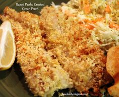 a green plate topped with fried chicken, coleslaw and breaded potato patties