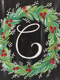 a painted christmas wreath with the letter g on it's side and berries, mists, and leaves