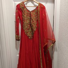 Beautiful Bright Red Chiffon/Georgette Anarkali With Gold Details Red And Black Beading Details At The Back Heavy Embroidery And Beautiful Details All Around. Perfect For Mehendi/Sangeet Parties Or Wedding Reception Only Worn It Once For A Reception This Dress Can Fit Medium And Large Sizes With Room For Alterations Has Been Dry Cleaned So Ready To Wear! Georgette Anarkali, Dress Salwar Kameez, Red Chiffon, Heavy Embroidery, Gold Details, Salwar Kameez, Anarkali, Bright Red, Red And Black