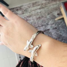 This handcrafted sterling silver cuff bracelet bangle features the traditional Greek Minoan Dolphins Motif. Being handmade it may have small differences in w Sterling Silver Cuff Bracelet, Bracelet Bangle, Sterling Silver Cuff, Silver Cuff Bracelet, Silver Cuff, Ancient Greek, Chain Link Bracelet, Link Bracelets, Precious Metals