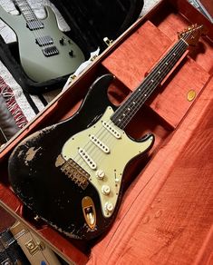 an electric guitar in a case on display