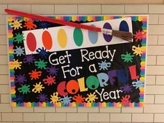 a sign that says get ready for a colorful year on the side of a wall