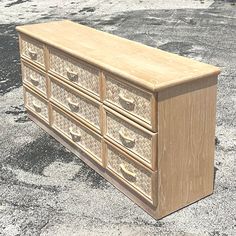 a wooden dresser sitting on top of a parking lot