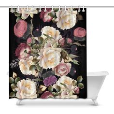 a black shower curtain with pink and white flowers on it, against a dark background