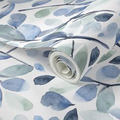 blue and green watercolor leaves on white background wallpaper with rolled up paper roll