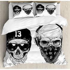 a bed with two skulls wearing masks on it