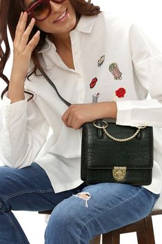 This classic little bag made from tough woodsy green croc embossed leather, is ideal for an every day carry.  It will also look extremely stylish at the same time.   It features red leather lining and 14k gold plated hardware.  There is also an adjustable cross body strap as well. #designerhandbags #luxurybags #designerbagb#affordablebags Woman Outfit Ideas, Designer Leather Handbags, Woman Outfit, Green Hand, Cocktail Attire, Every Day Carry, Top Handle Bags, Iconic Bags, Boutique Brands