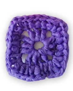 a purple crochet square is shown on a white background