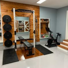 a home gym with exercise equipment and treadmills