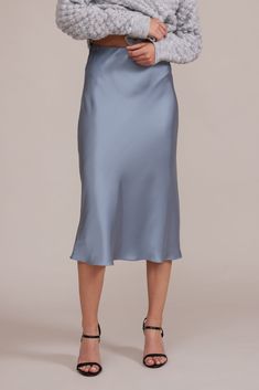 Effortlessly elegant, the Zoie Skirt will add a pop of ice blue to your wardrobe and showcase your playful side with its side slit. Perfect for any occasion, this satin skirt will make you stand out in style. Elastic waistband True to size Grey Satin Skirt, Blue Slip Skirt, Satin Skirt Outfit Classy, Blue Satin Skirt, White Satin Skirt, Satin Skirt Outfit, Skirt Model, Knit Bottom, Slip Skirt