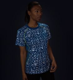 High-Visibility Apparel for High Performance from Day to Night Go on amazing adventures and never worry about the sun setting down with our Women's Reflective Performance Short Sleeve Shirt that keeps you visible on the road! Specially designed for active individuals who love the outdoors and running, our reflective shirts for men and women let you stay conspicuous in nighttime and low-light conditions. Eliminates the need for clunky reflective vests and uncomfortable safety armbands, so you can Blue Short Sleeve Tops For Light Exercise, Blue Sporty Tops For Outdoor Activities, Blue Crew Neck Activewear For Outdoor Activities, Sporty Blue Tops For Outdoor Activities, Sporty Blue T-shirt For Outdoor Activities, Graphic Print Athleisure For Outdoor Activities, Athleisure Activewear With Graphic Print For Outdoor Activities, Athleisure Activewear With Graphic Print For Outdoor, Blue Moisture-wicking T-shirt For Outdoor Activities