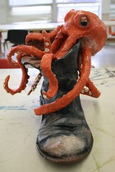 an octopus sculpture sitting on top of a table