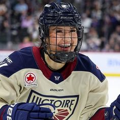 the hockey player is smiling and ready to play