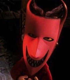 an animated character wearing a red mask and holding a cell phone