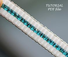 the beaded bracelet is made with white and blue beads