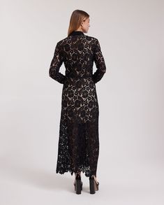 The VIOLETA is a semi-sheer black floral lace dress with a pointed collar and a white button placket that extends down the center front. This full-length dress features a removable sheer dress lining and long sleeves that are finished with single cuffs that allow for cufflinks. The VIOLETA is adorned with a delicate floral scalloped hem and princess darts on the back for a more accentuated silhouette. The VIOLETA dress is being revisited for the Spring-Summer 2023 collection as a complimentary s Lace Long Dress, Dress Lining, Spring Sneakers, Full Length Dress, Floral Lace Dress, Lace Dress Long, Fall Coat, 2023 Collection, Scalloped Hem