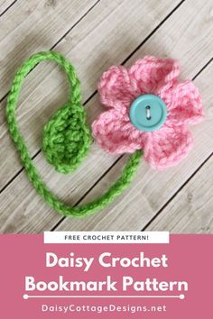 a crocheted flower with a blue button in the center and text overlay that says daisy crochet bookmark pattern