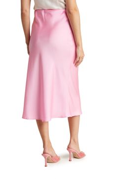 Elevate your wardrobe with this pull-on bias satin midi skirt for elegant, feminine style. 31" length (size S) Elasticized waist Pull-on style Satin construction 97% polyester, 3% spandex Machine wash cold, line dry Made in USA Model’s stats for sizing: 5’10” height, 34” bust, 27” waist, 35” hips. Model is wearing size S. Formal Pink Satin Bottoms, Spring Bias Cut Skirt, Elegant Pink Satin Bottoms, Spring Satin Skirt For Night Out, Satin Midi-length Bottoms For Party, Satin Midi Bottoms For Party, Satin Midi-length Party Bottoms, Satin Asymmetrical Skirt With Lining, Spring Pink Satin Bottoms