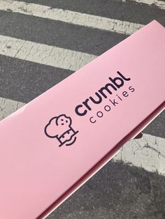 a pink sign that says crumb cookies on it