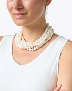 Make a statement with this stunning multi-strand fresh water pearl necklace by Kenneth Jay Lane. Featuring a gold-tone clasp this style is an instant classic. When it comes to pearls, don't be afraid to work in heirloom favorites from your collection-- this necklace looks fantastic layered with longer strands for a thoroughly modern look. Wear yours with a crew neck cashmere sweater and blue jeans for a for a chic, timelessly sophisticated look. Luxury Multi-strand Pearl Chain Necklace, Formal Multi-strand Pearl Necklace, Formal Multi-strand Pearl Necklace With Charm, Multi-strand Pearl Drop Necklace, Multi-strand Pearl Necklace With Pearl Charm, Fresh Water Pearl Necklace, Water Pearl Necklace, Fresh Water Pearl, Don't Be Afraid