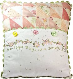 a pillow with some buttons on it that says, from simple things come simple joy