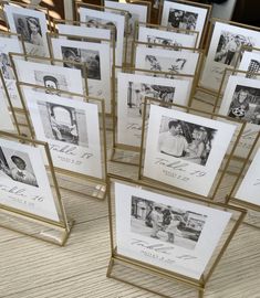 many framed pictures are on display in gold frames with black and white photos behind them